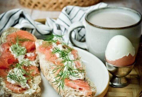 white ceramic mug on white ceramic plate
