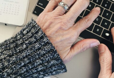 person wearing silver ring on left hand